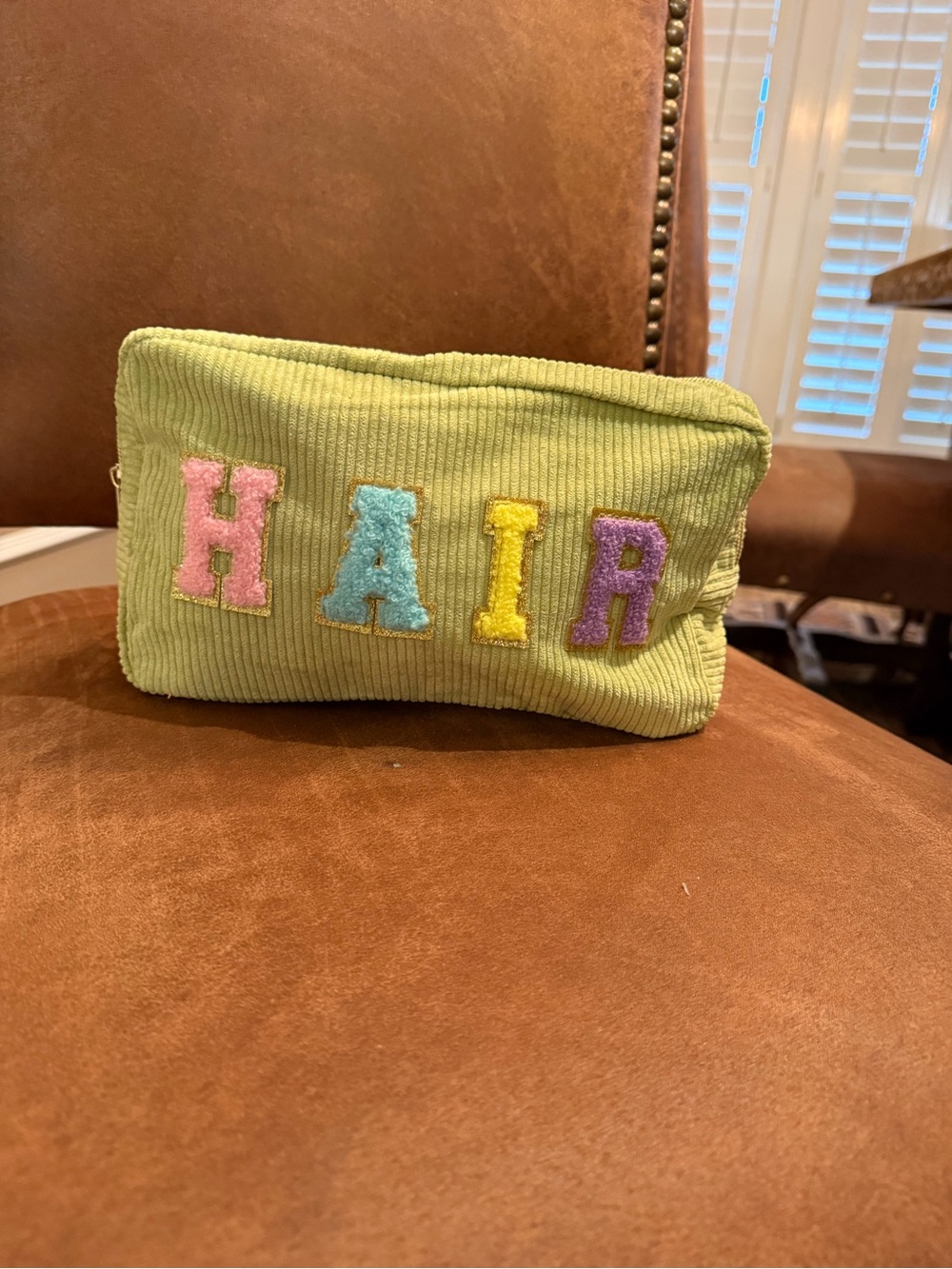 Green Corduroy Cosmetic Pouch with Colorful 'HAIR' Appliqué